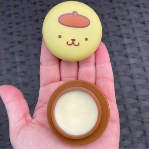 Sanrio x The Crème Shop: Pompompurin Macaron Lip Balm